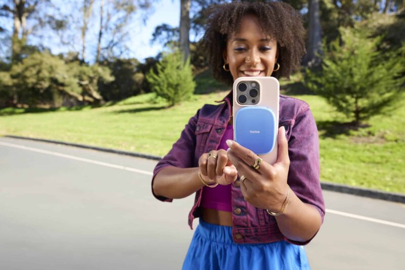 Life: SanDisk Creator Phone SSD Portable SSD with MagSafe, Lifes SanDisk Creator Phone SSD - Lifestyle, attached to iPhone
